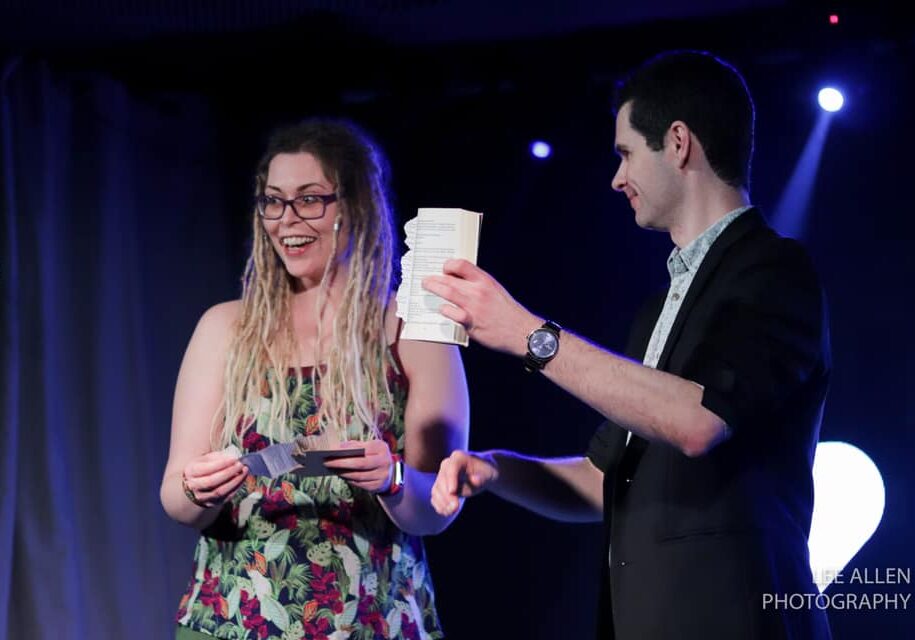 stage magician with suprised audience member