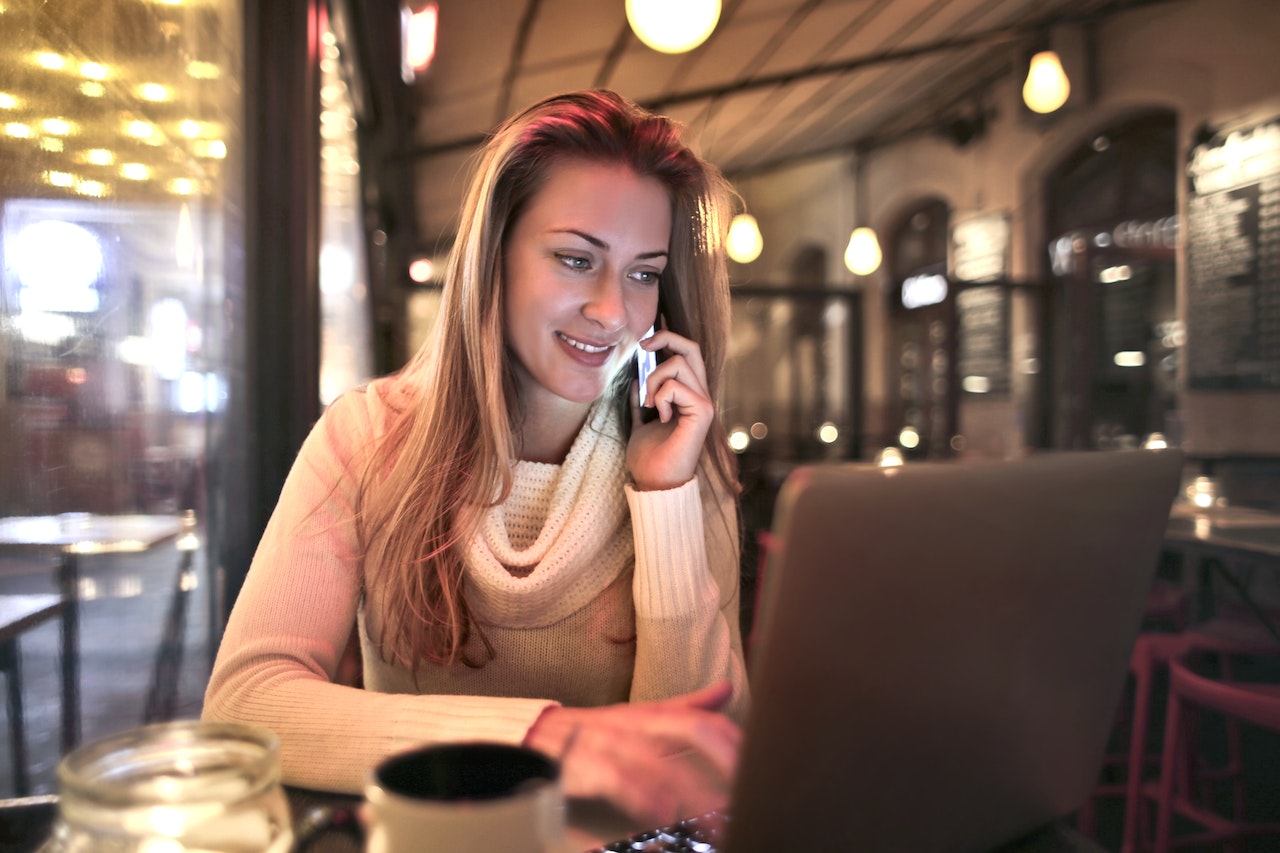 phone calls a woman making a phone call in a bar